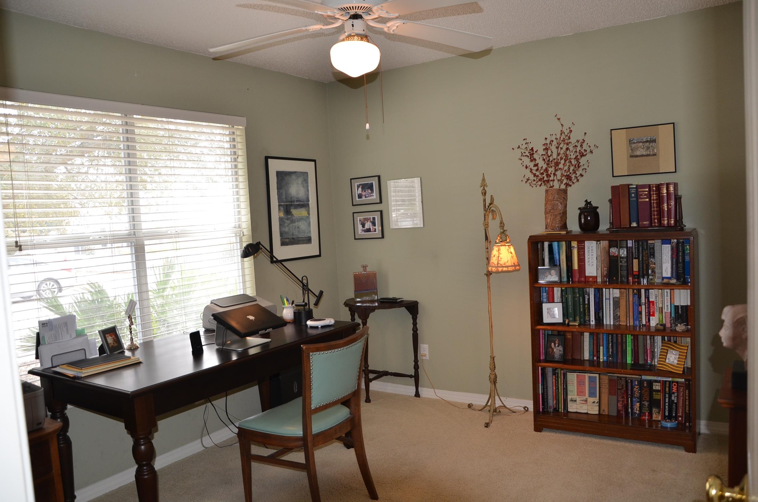 4456 Clipper Cove Destin, FL 32541 - Photo 17 of 31 a living room with furniture and a bookshelf