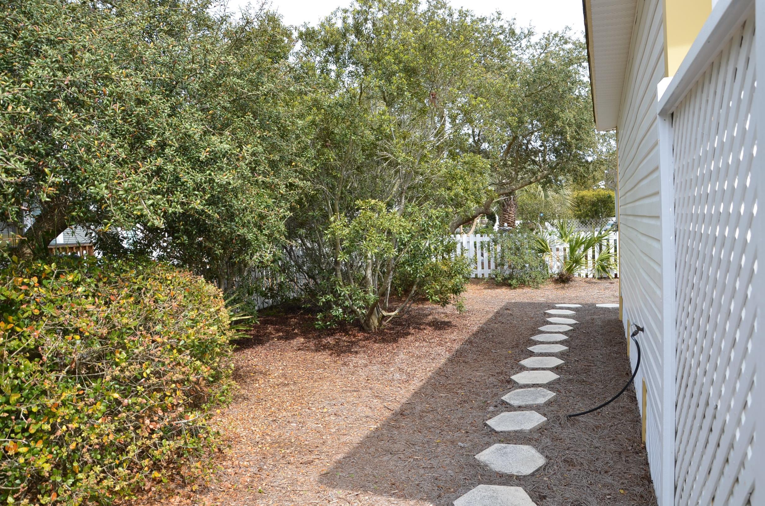 4456 Clipper Cove Destin, FL 32541 - Photo 19 of 31 a view of a yard with plants and trees