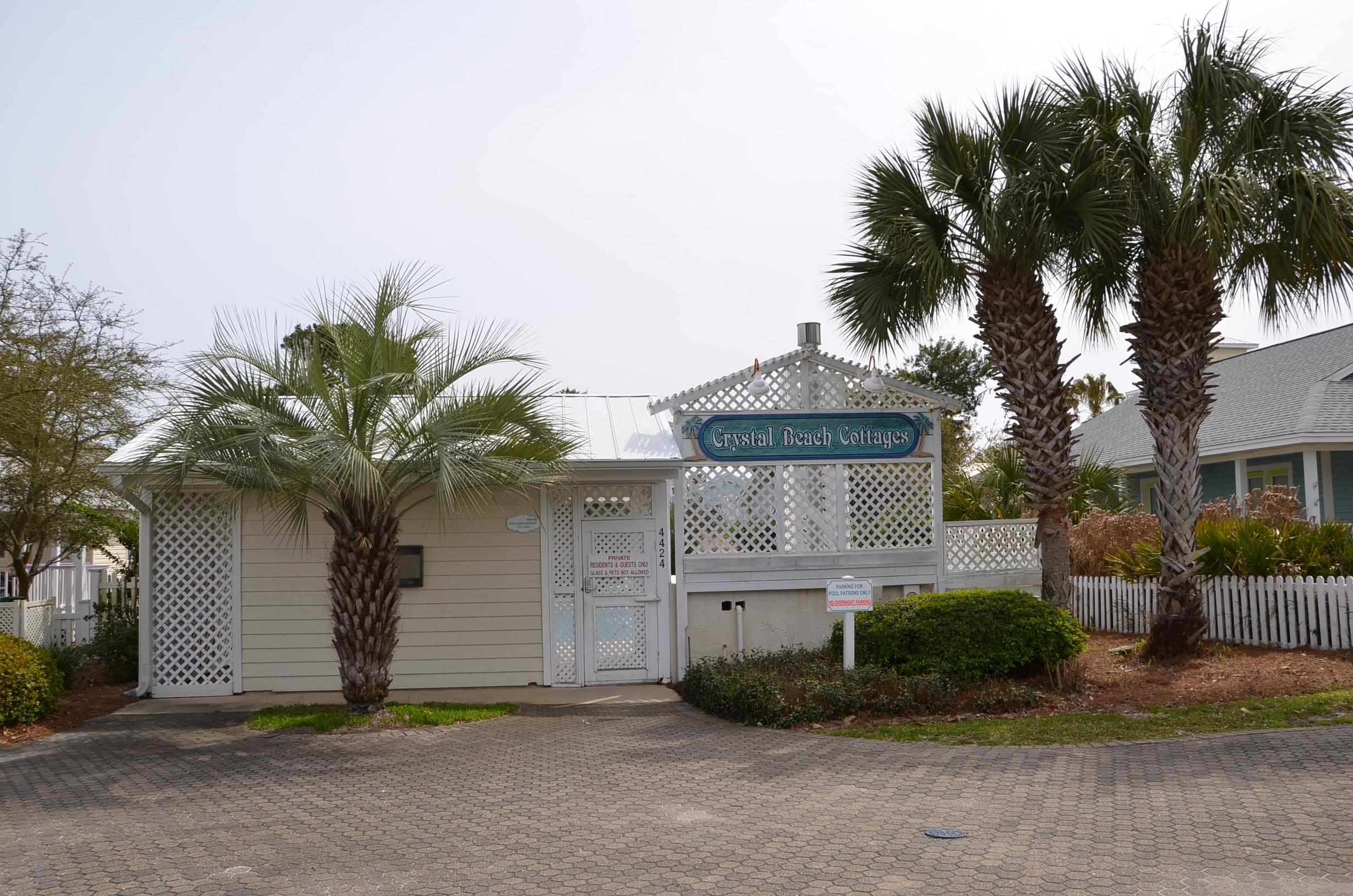4456 Clipper Cove Destin, FL 32541 - Photo 27 of 31 a front view of a house with a yard and garage