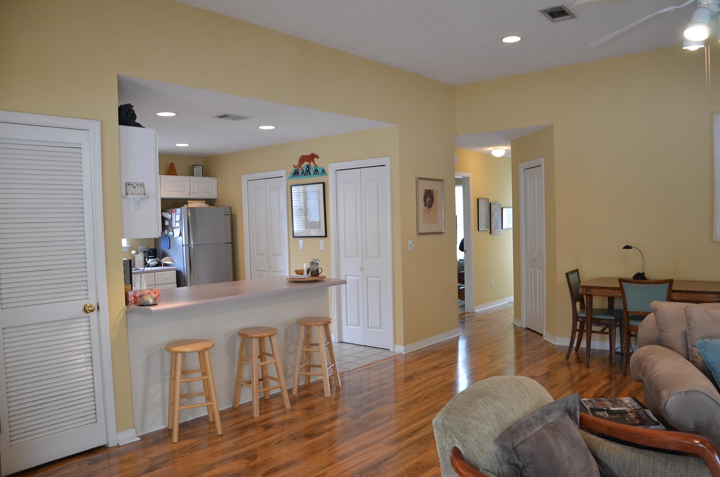4456 Clipper Cove Destin, FL 32541 - Photo 5 of 31 a view of a dining room with furniture and wooden floor