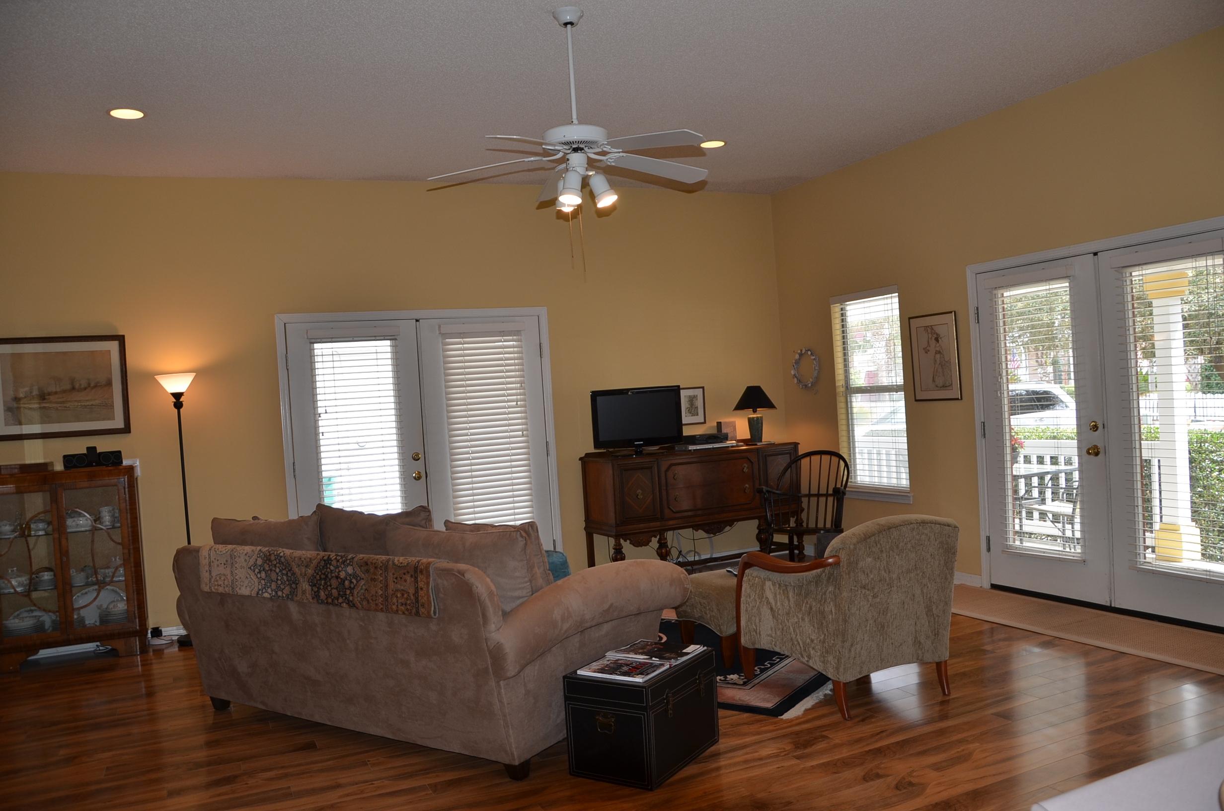4456 Clipper Cove Destin, FL 32541 - Photo 7 of 31 a living room with furniture and a lamp