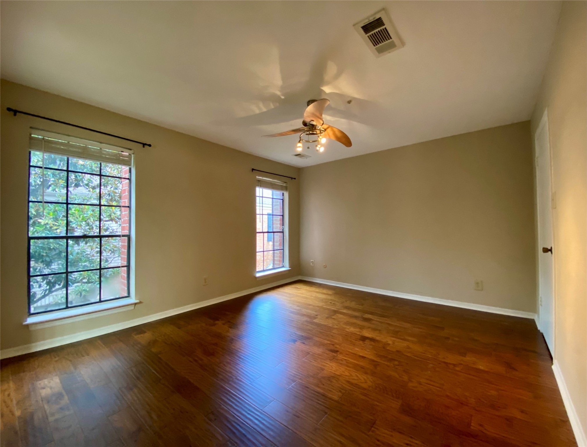 a view of an empty room with windows