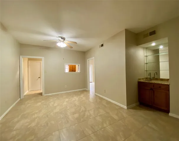 a view of empty room with a fireplace