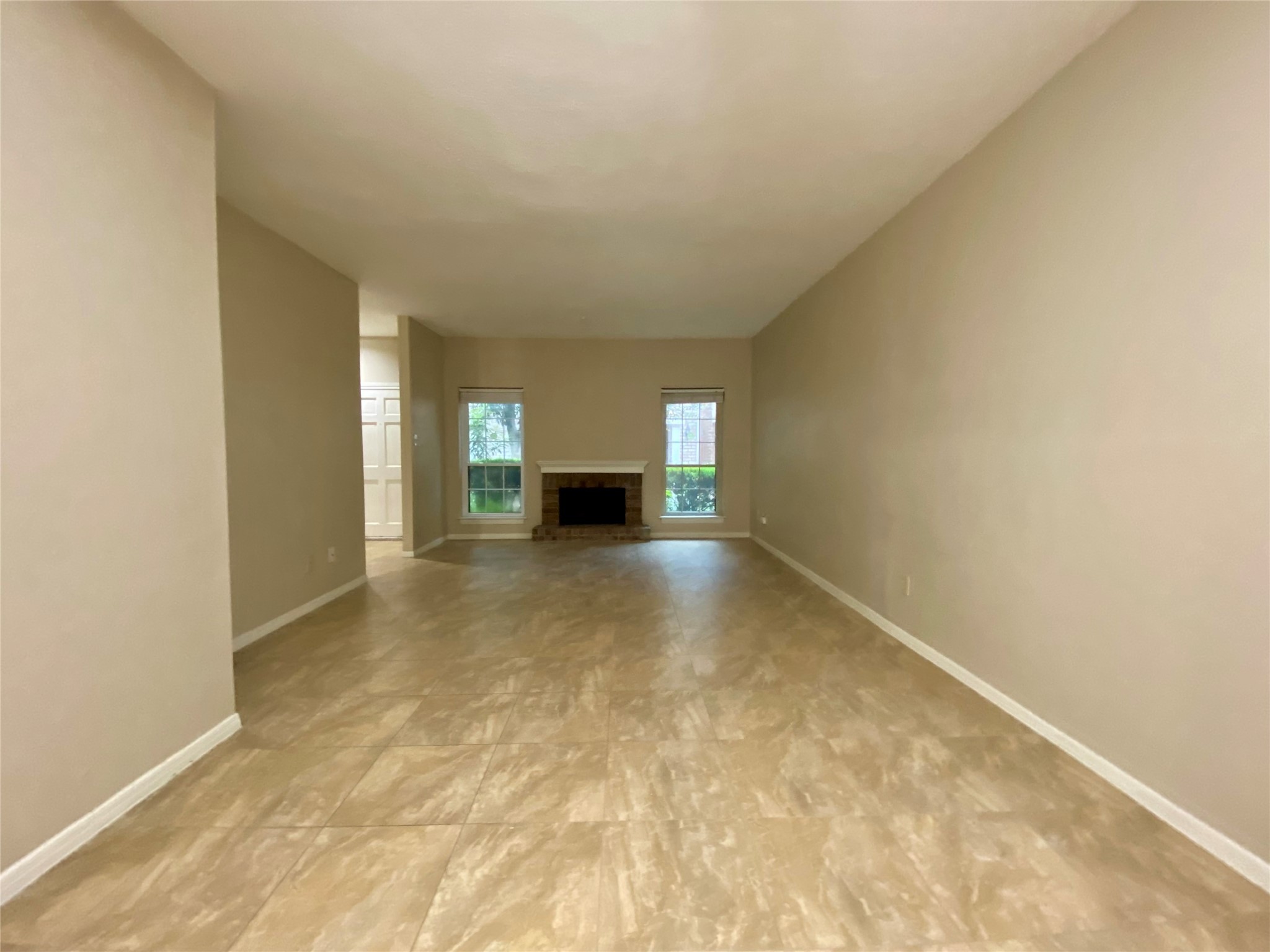 752 Augusta Drive Houston, TX 77057 - Photo 12 of 39 a view of empty room with a fireplace