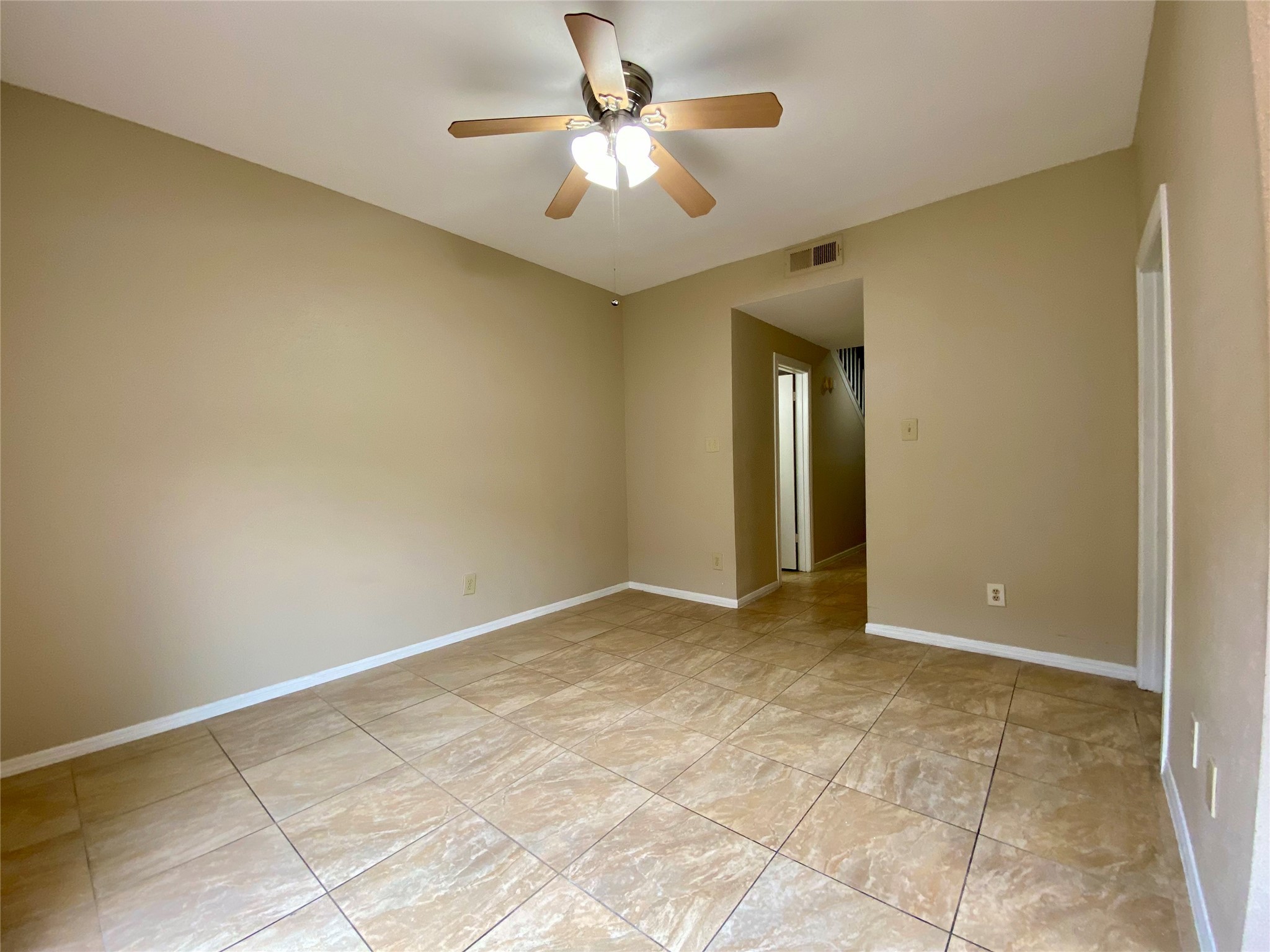 752 Augusta Drive Houston, TX 77057 - Photo 13 of 39 a view of an empty room and chandelier fan