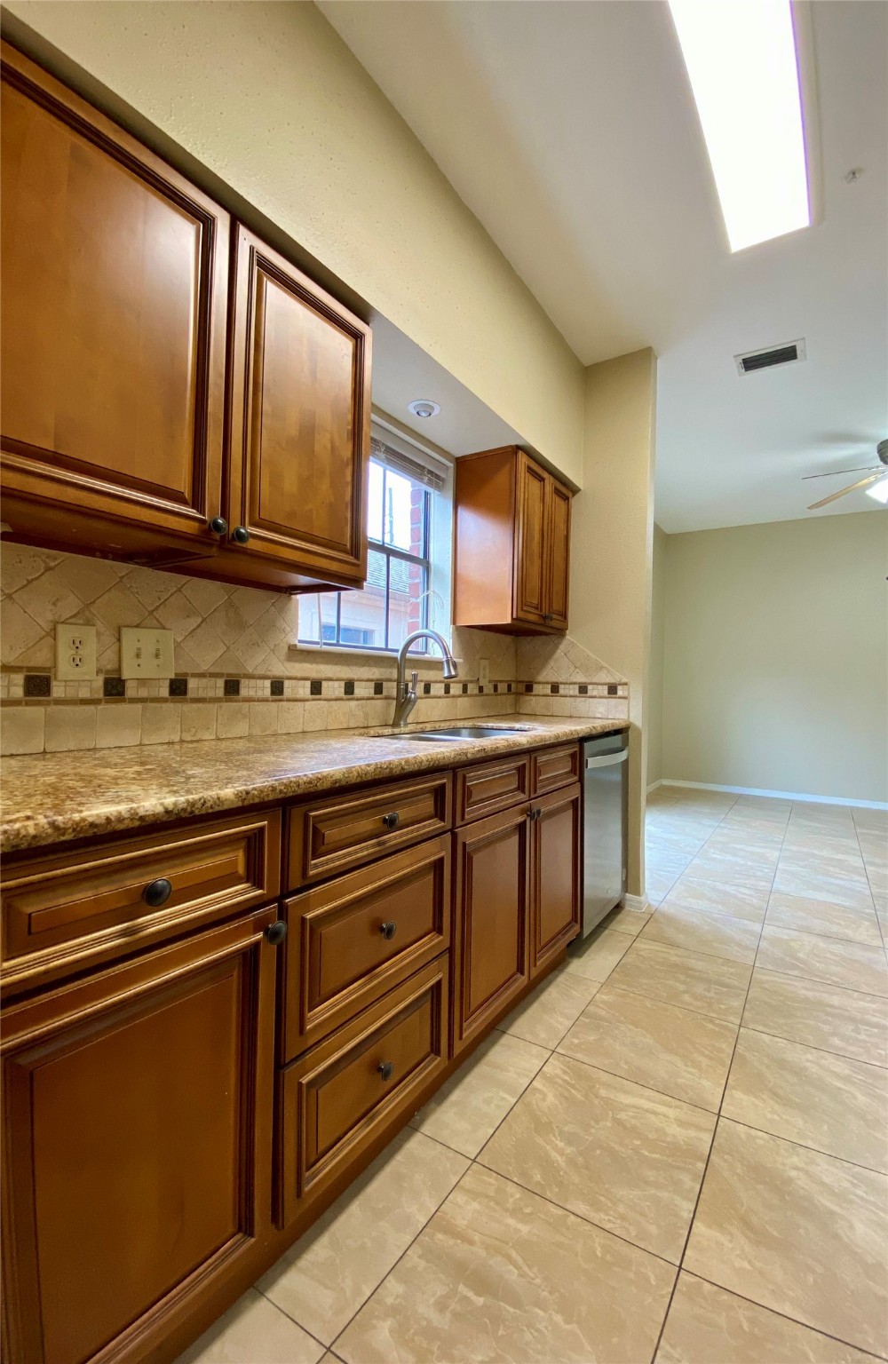 752 Augusta Drive Houston, TX 77057 - Photo 16 of 39 a kitchen with stainless steel appliances granite countertop a stove a sink and a microwave