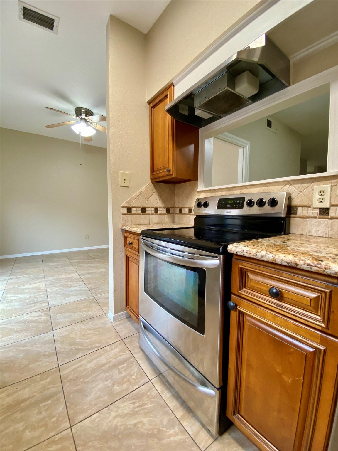 752 Augusta Drive Houston, TX 77057 - Photo 17 of 39 a stove top oven sitting inside of a kitchen