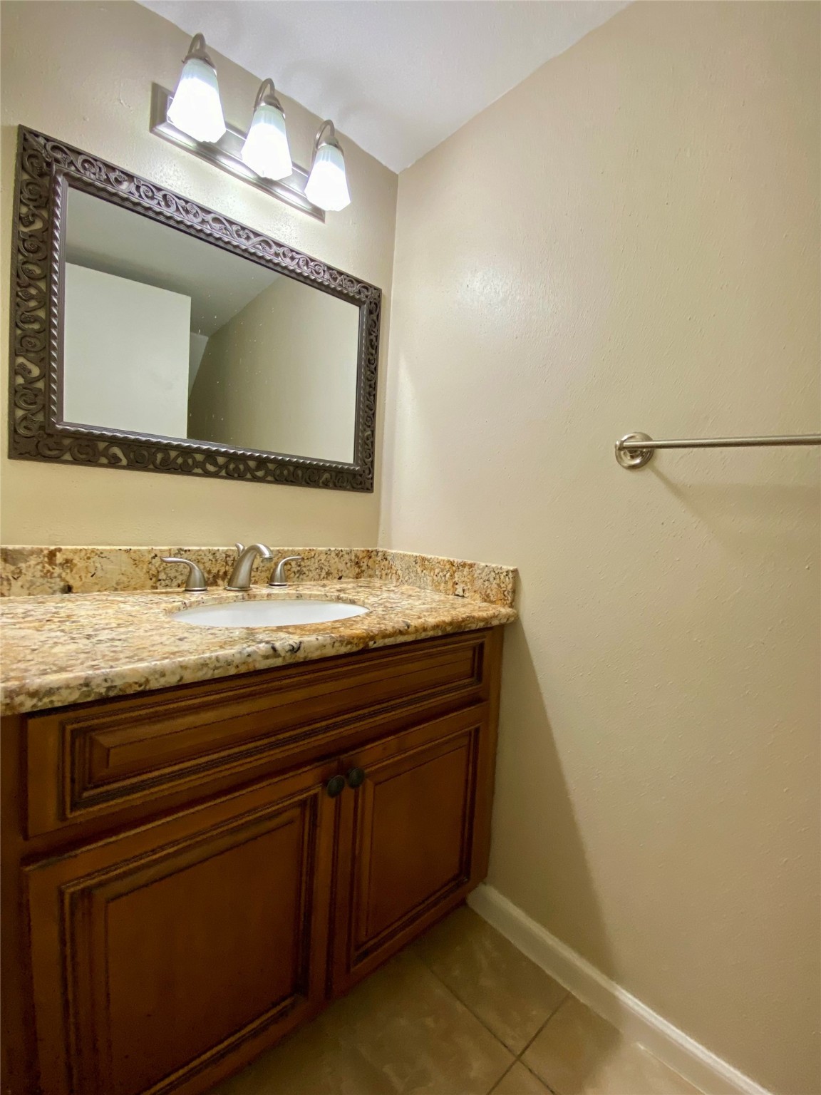 752 Augusta Drive Houston, TX 77057 - Photo 20 of 39 a bathroom with a sink and a mirror