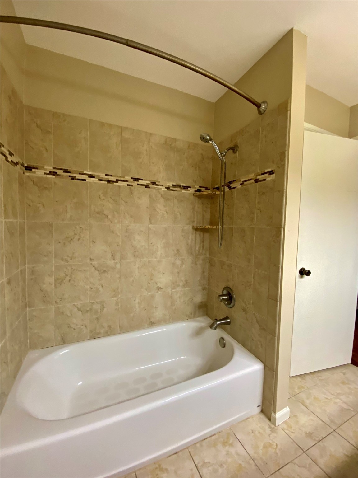 752 Augusta Drive Houston, TX 77057 - Photo 27 of 39 a bathroom with a shower and a bath tub