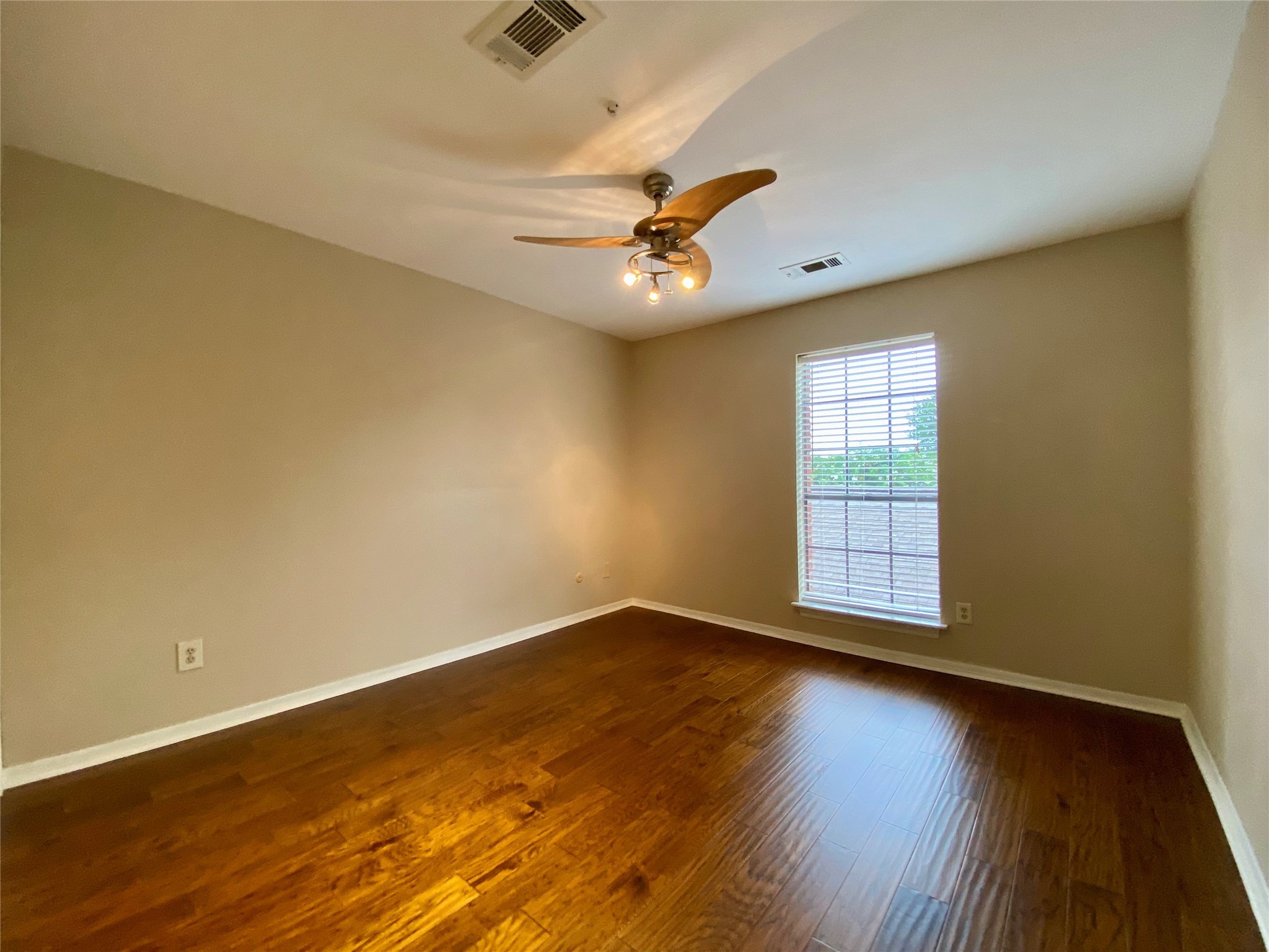 752 Augusta Drive Houston, TX 77057 - Photo 28 of 39 wooden floor in an empty room with a window