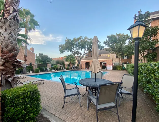 a view of a house with swimming pool