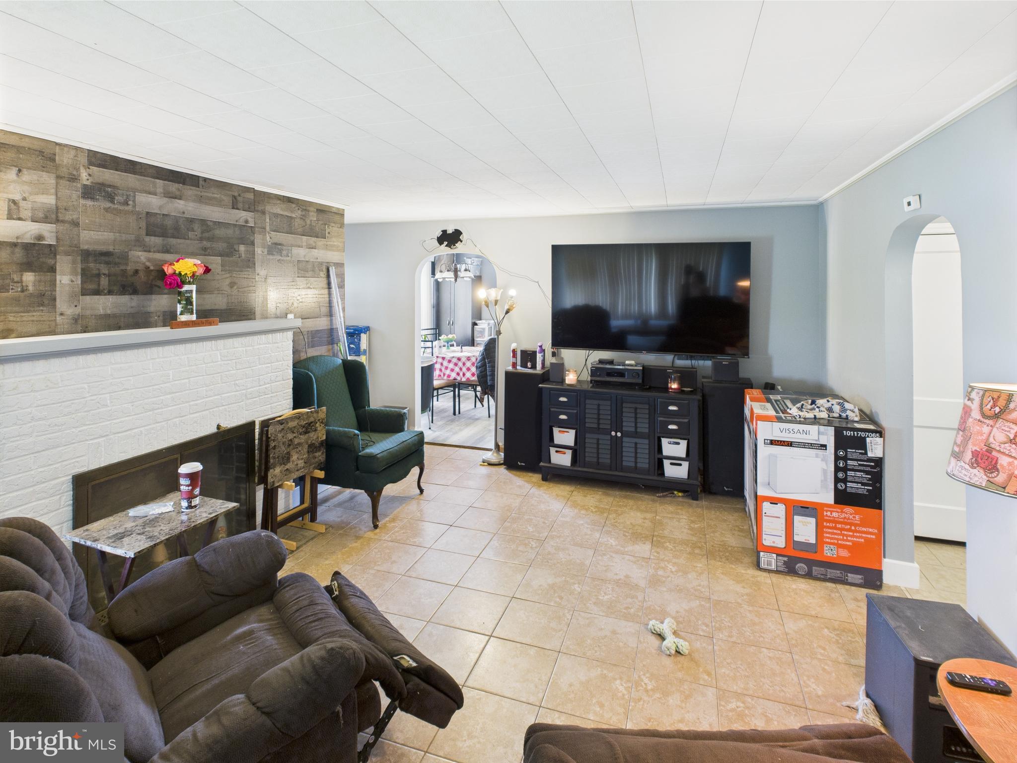 1207 Orems Road Baltimore, MD 21220 - Photo 11 of 33 a living room with furniture and a flat screen tv