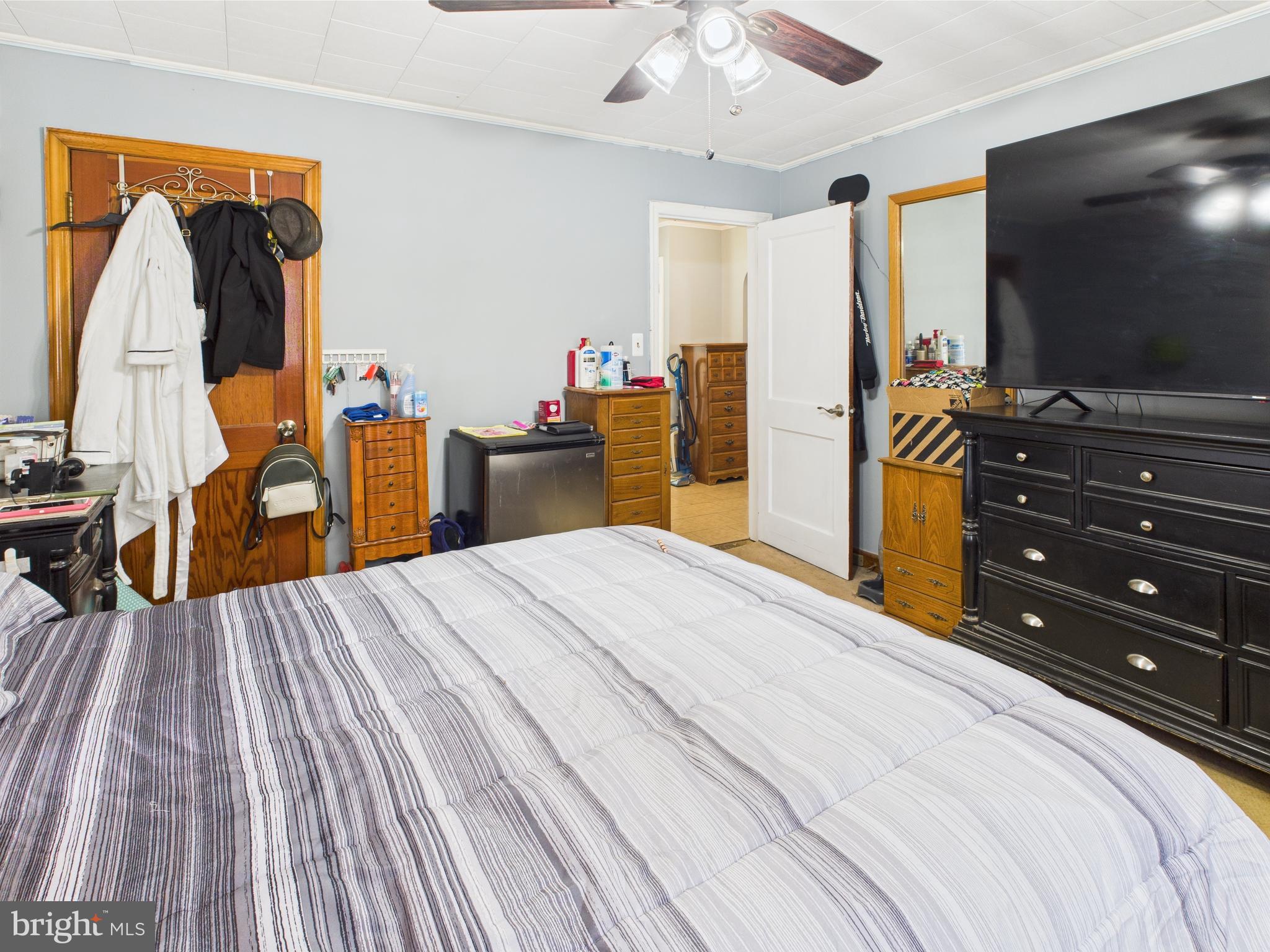 1207 Orems Road Baltimore, MD 21220 - Photo 13 of 33 a bedroom with a bed and a flat tv screen on dresser