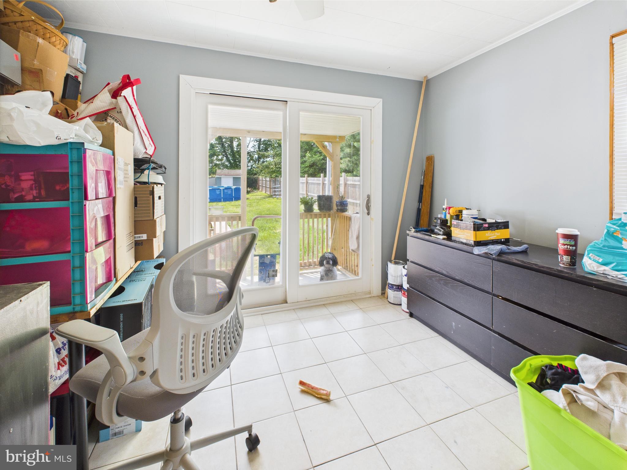1207 Orems Road Baltimore, MD 21220 - Photo 15 of 33 a view of a workspace with furniture and a window