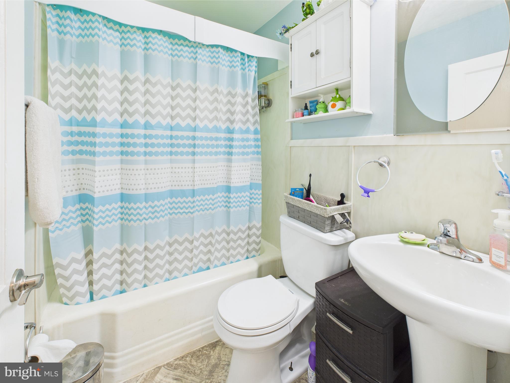1207 Orems Road Baltimore, MD 21220 - Photo 16 of 33 a bathroom with a sink toilet and shower