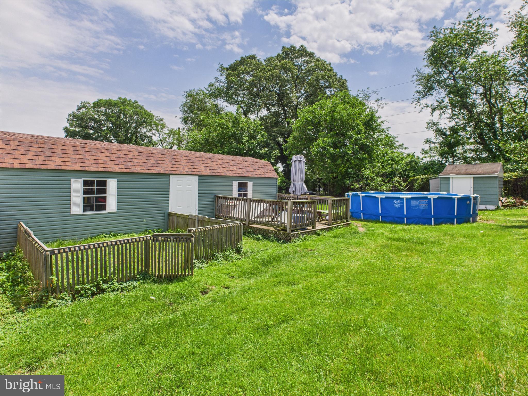 1207 Orems Road Baltimore, MD 21220 - Photo 27 of 33 a view of a house with a backyard and a large tree
