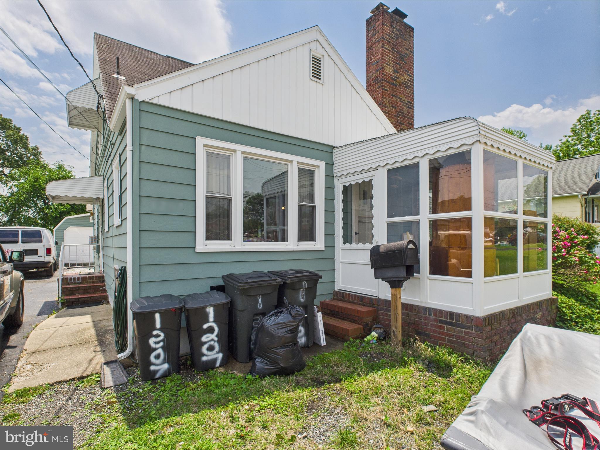 1207 Orems Road Baltimore, MD 21220 - Photo 3 of 33 a front view of a house with a garden