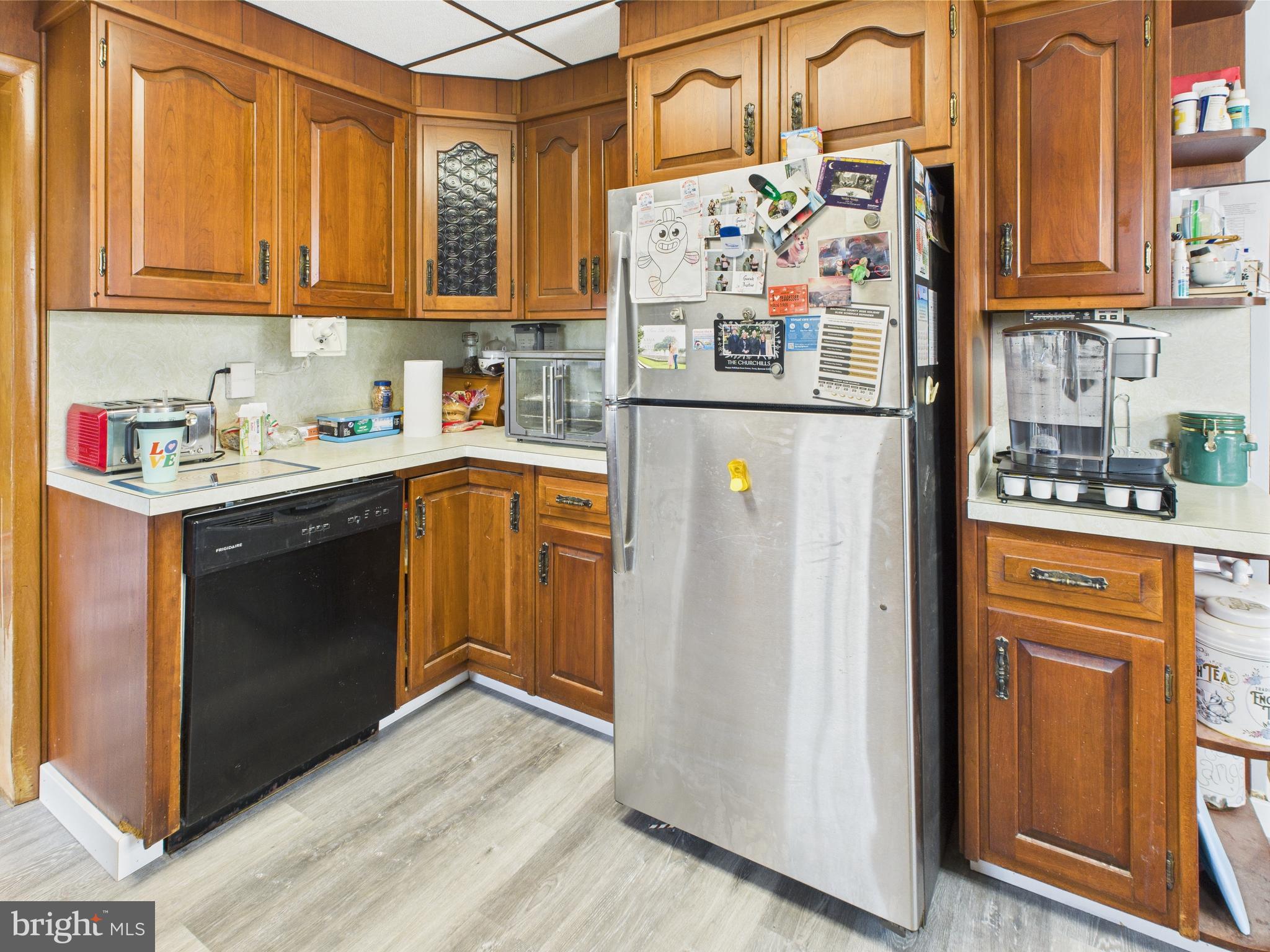 1207 Orems Road Baltimore, MD 21220 - Photo 6 of 33 a kitchen with stainless steel appliances granite countertop a refrigerator and a stove top oven