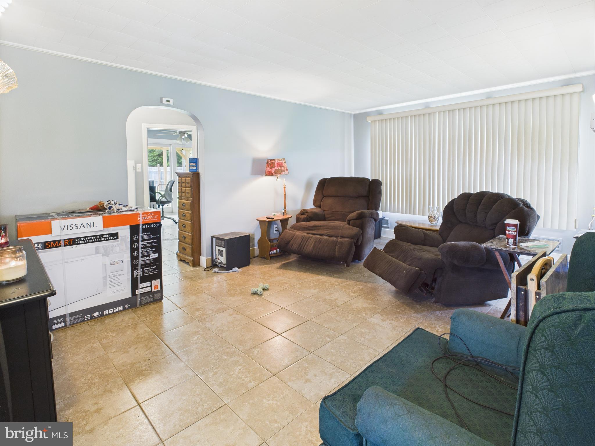 1207 Orems Road Baltimore, MD 21220 - Photo 10 of 33 a living room with furniture and a flat screen tv