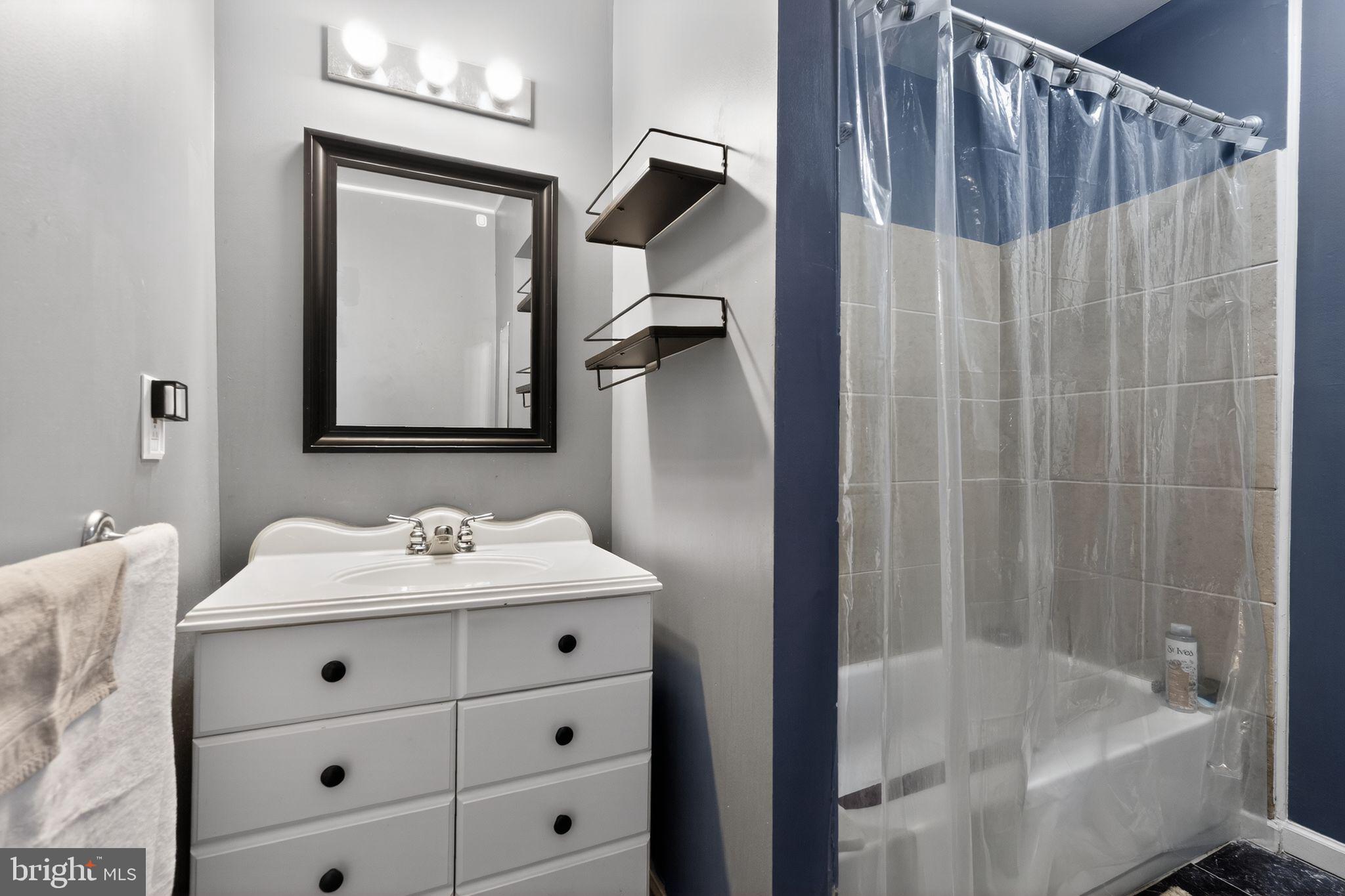285 Via Cascata Drive Clementon, NJ 08021 - Photo 13 of 15 a bathroom with a sink and a mirror