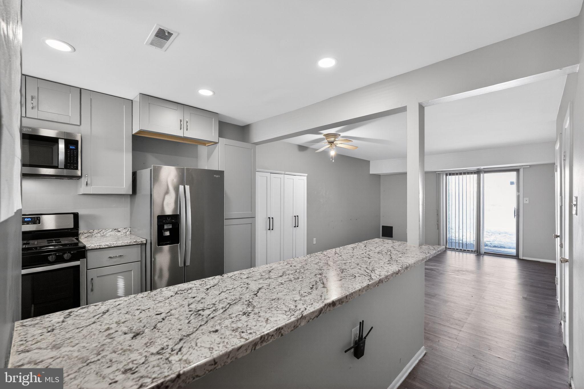 285 Via Cascata Drive Clementon, NJ 08021 - Photo 3 of 15 a large kitchen with kitchen island a sink stainless steel appliances and cabinets