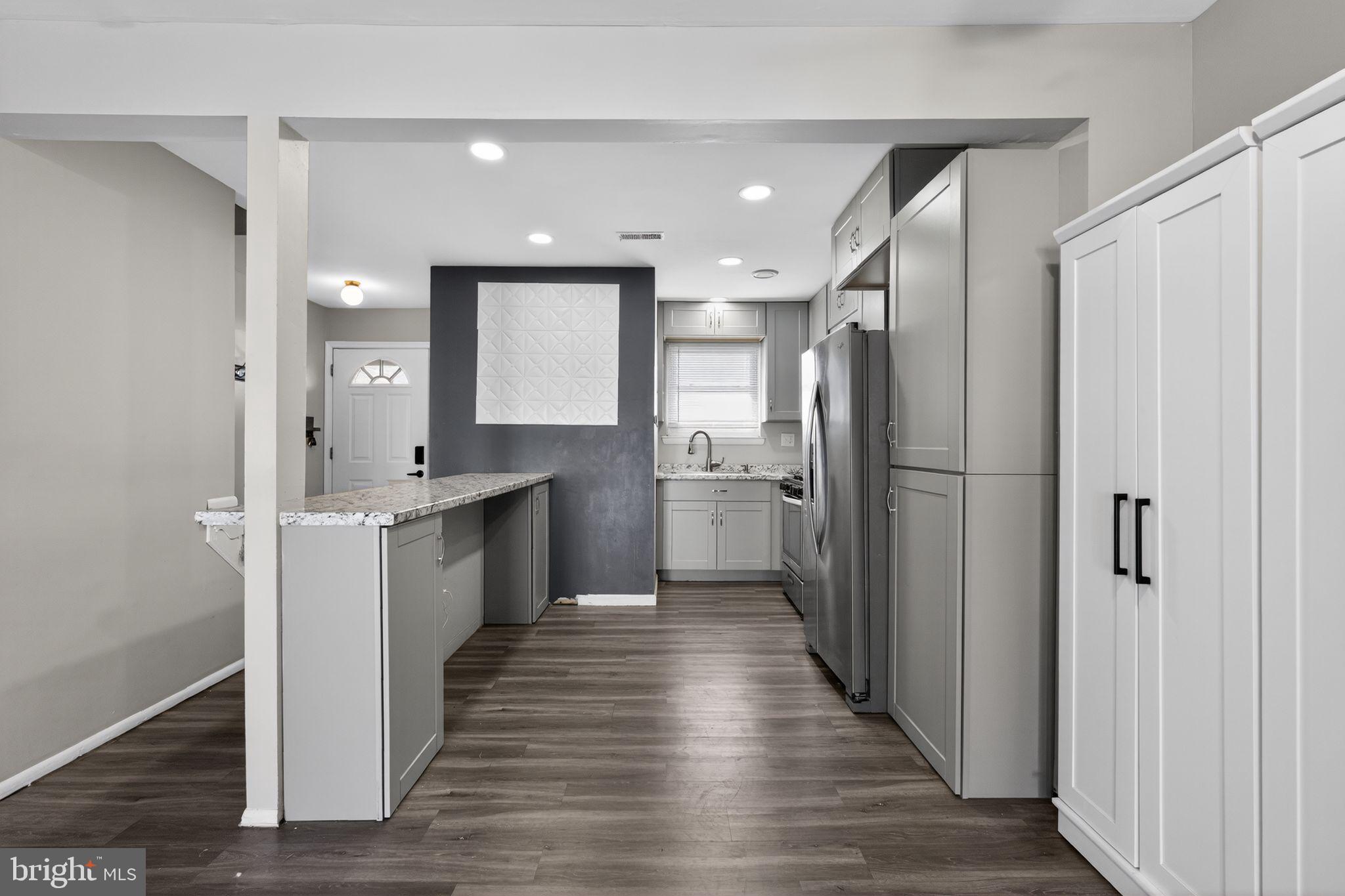 285 Via Cascata Drive Clementon, NJ 08021 - Photo 4 of 15 a kitchen with a refrigerator sink and cabinets