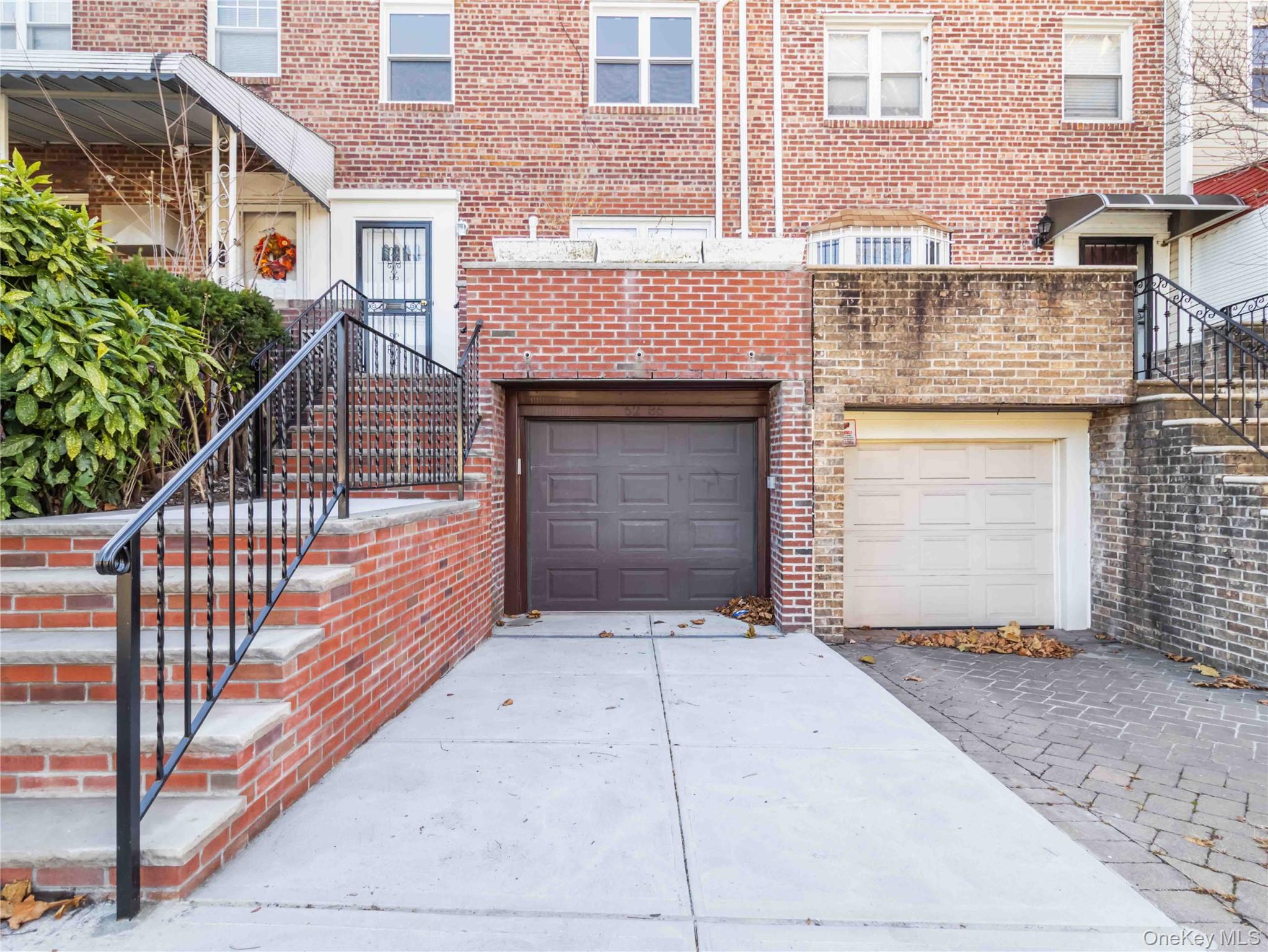 a front view of a house with a garage