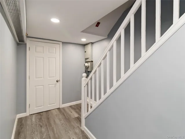 a view of an entryway with wooden floor