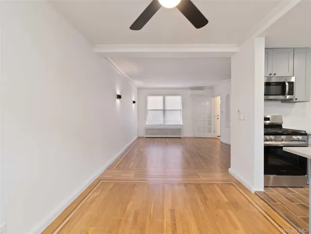 a view of a livingroom with wooden floor