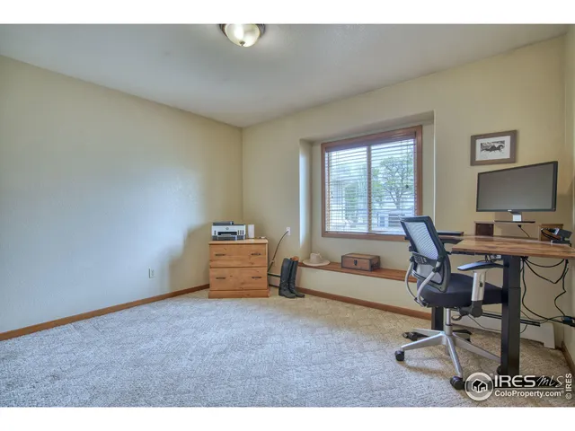 a workspace with furniture and a window