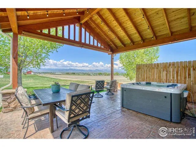 a view of a chairs and table in the patio