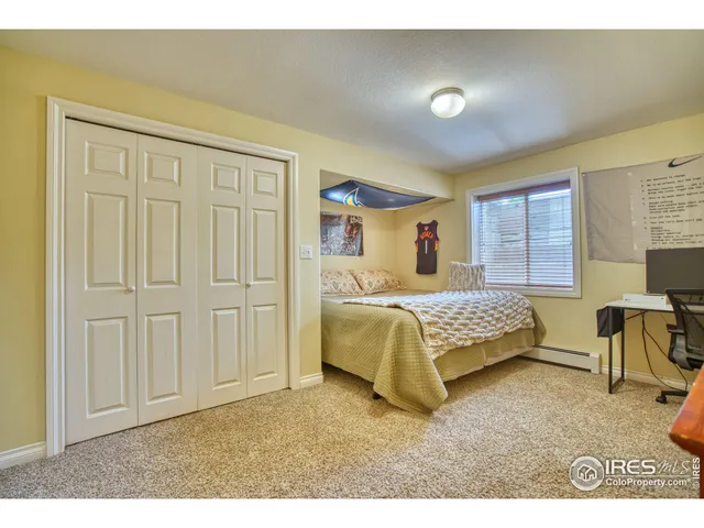 a bedroom with a bed and chair