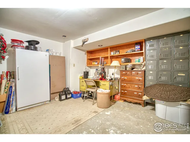a kitchen with a refrigerator and a sink