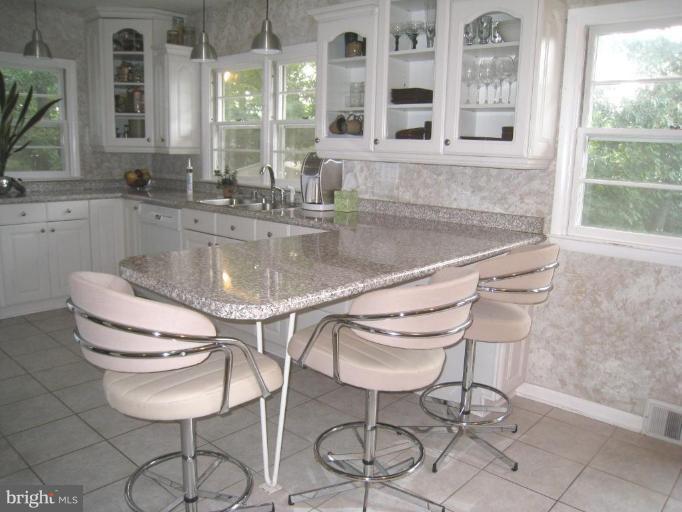 315 Hampton Road Linthicum Heights, MD 21090 - Photo 3 of 22 a kitchen with a table and chairs