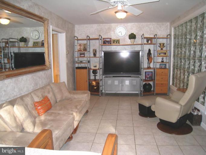 315 Hampton Road Linthicum Heights, MD 21090 - Photo 22 of 22 a living room with furniture and a flat screen tv