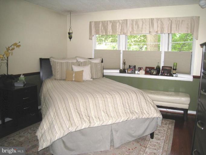 315 Hampton Road Linthicum Heights, MD 21090 - Photo 7 of 22 a bed sitting in a bedroom next to a window