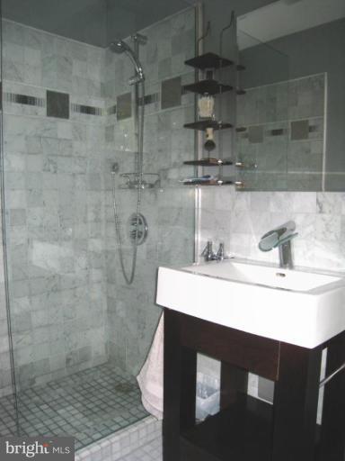 315 Hampton Road Linthicum Heights, MD 21090 - Photo 8 of 22 a bathroom with a sink a toilet and shower