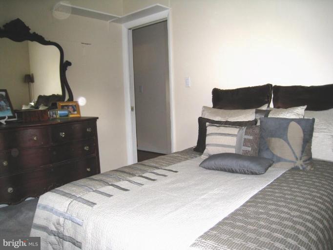 315 Hampton Road Linthicum Heights, MD 21090 - Photo 10 of 22 a bedroom with a bed and chair