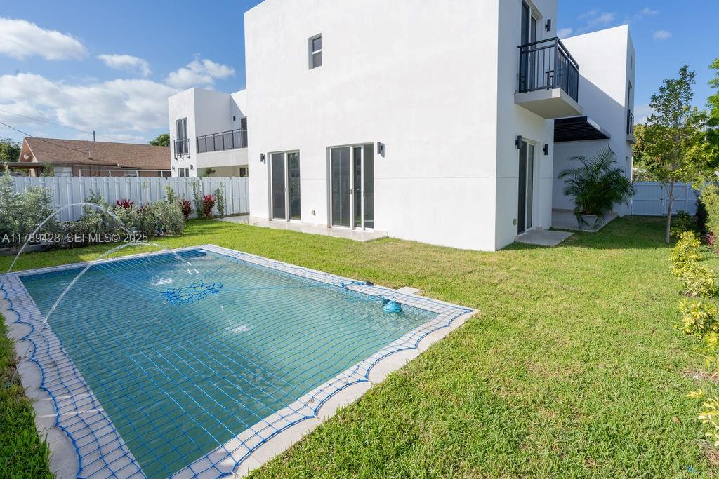 900 Southwest 24th Road Miami, FL 33129 - Photo 5 of 27 a view of a backyard with plants and a lake view
