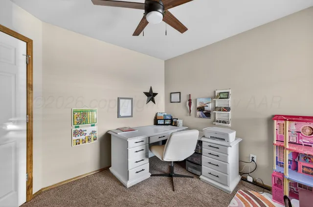 a workspace with furniture and window