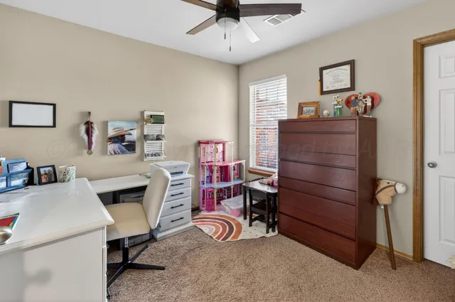 a view of a workspace with furniture