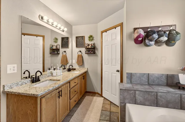 a en suite bathroom with a sink and a mirror