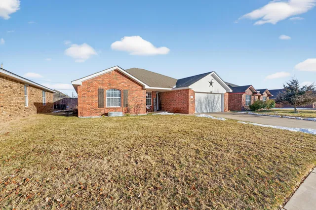 a view of house with yard and street view