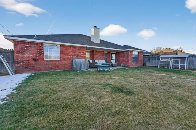 a large tree in front of a house