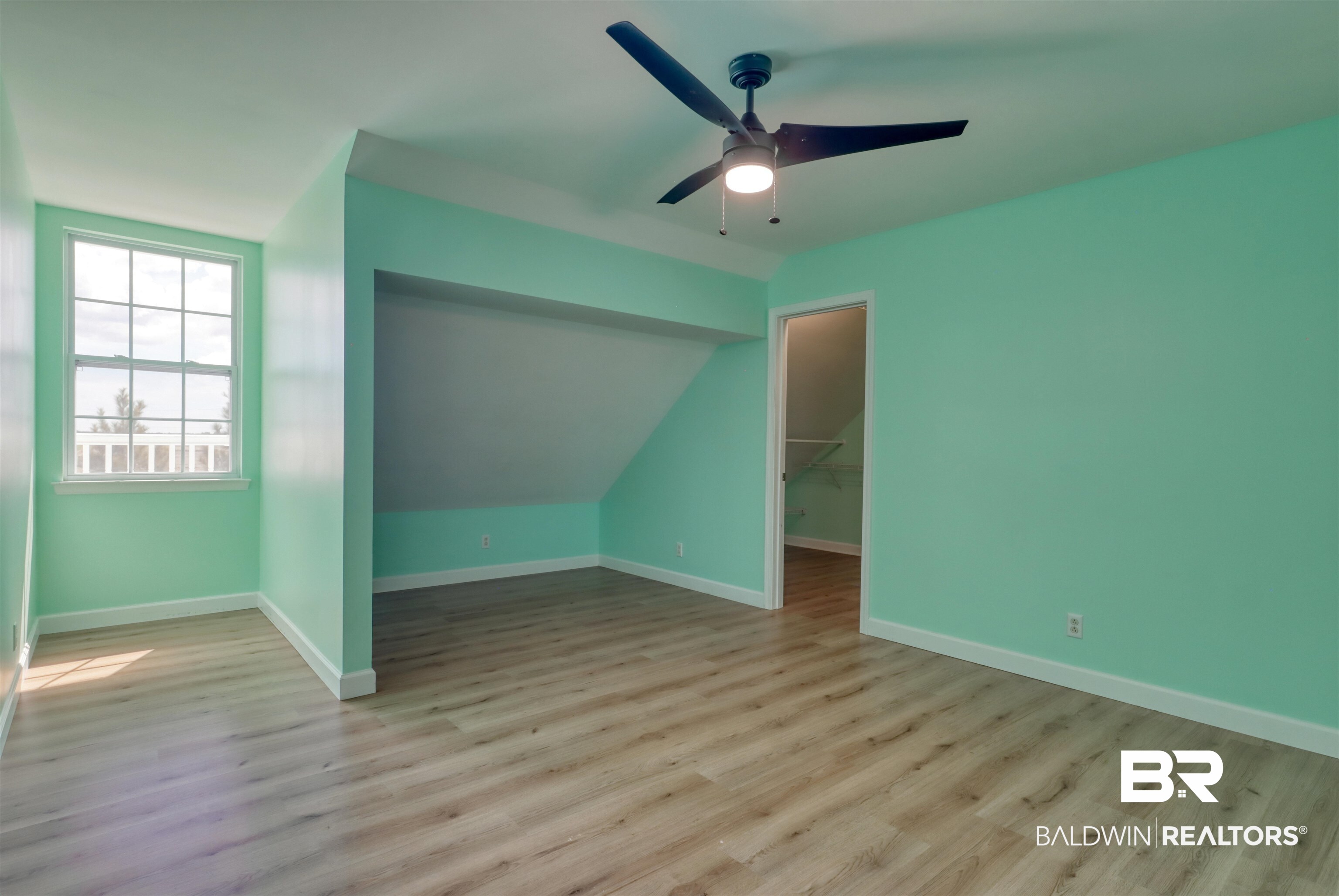28461 Gardner Road Elberta, AL 36530 - Photo 23 of 46 Bonus room featuring light wood-style flooring, a ceiling fan, and vaulted ceiling