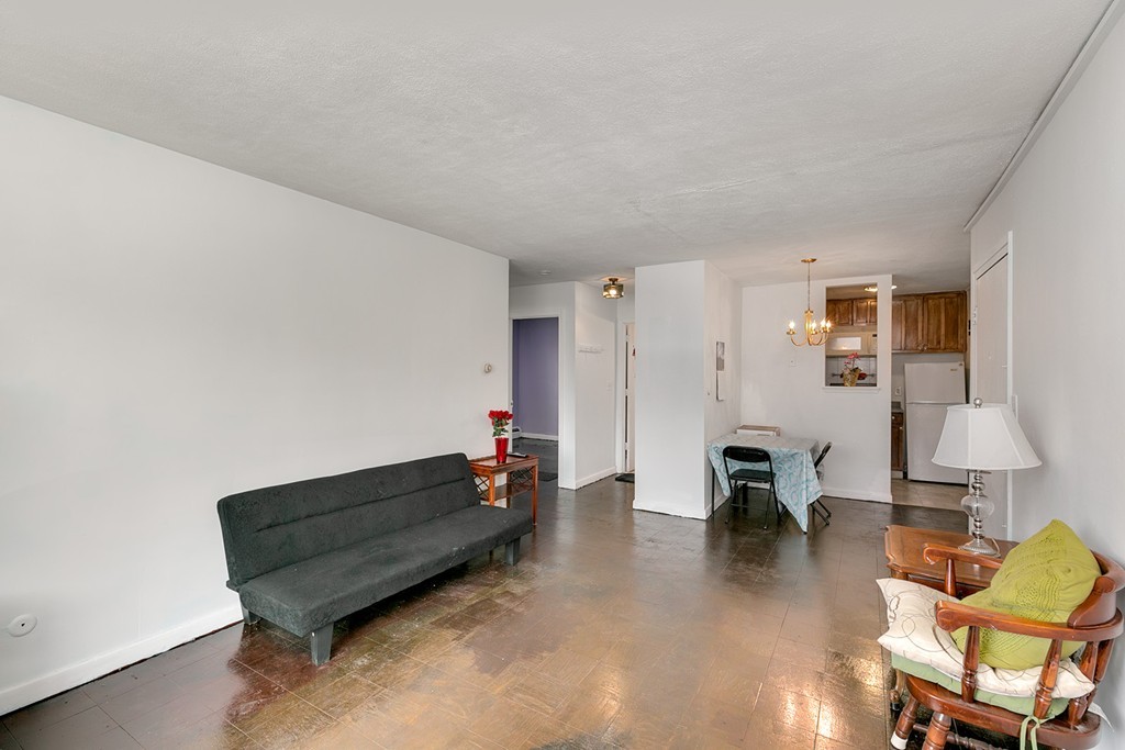 46 Adams Street, Unit C1 Boston, MA 02122 - Photo 7 of 13 a living room with furniture and a table
