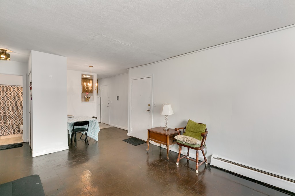 46 Adams Street, Unit C1 Boston, MA 02122 - Photo 8 of 13 a living room with furniture and a wooden floor