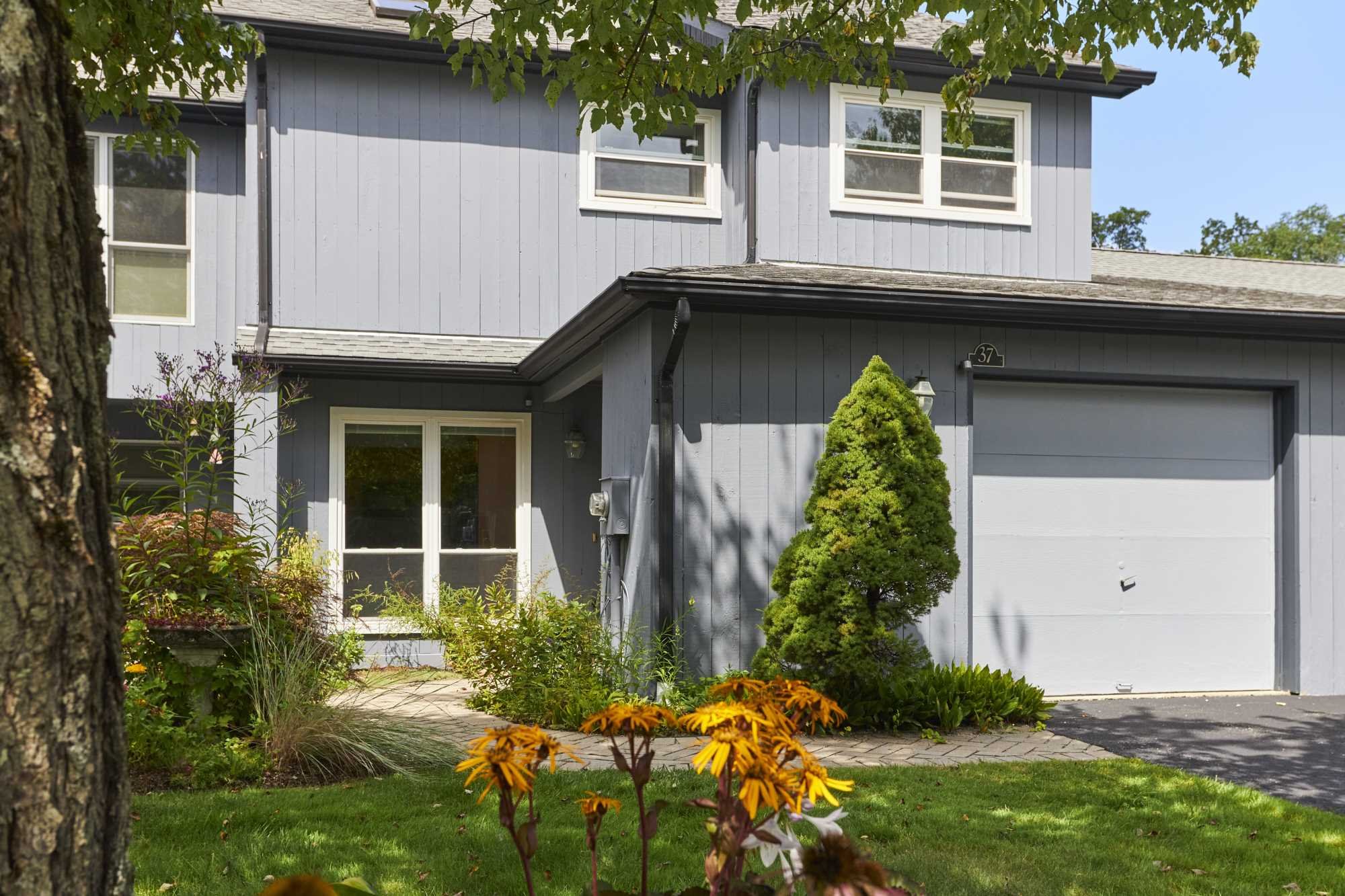a front view of a house with a yard