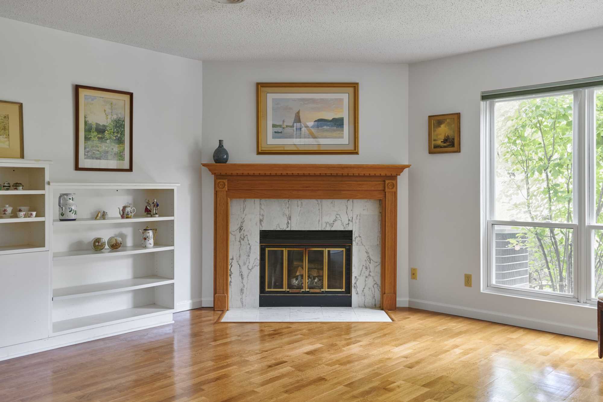 37 North Loop Rhinebeck, NY 12572 - Photo 7 of 13 a living room with a fireplace and a window