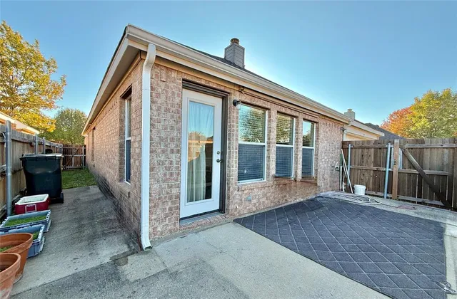 a view of backyard with seating space and deck